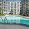 a swimming pool in a courtyard between buildings