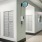 a room with white doors and a clock on the wall