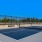 a tennis court with a fence